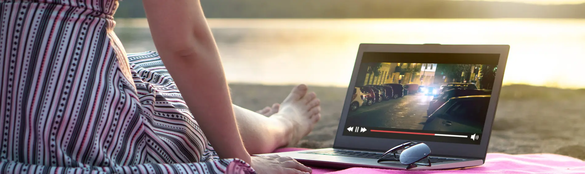 Woman watching something on a laptop.