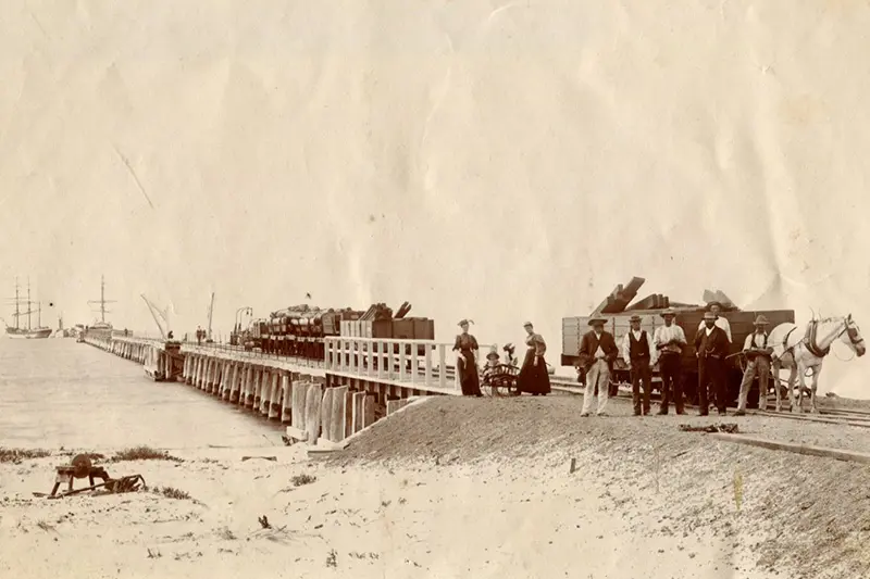 An old photo of the Busselton jetty construction.