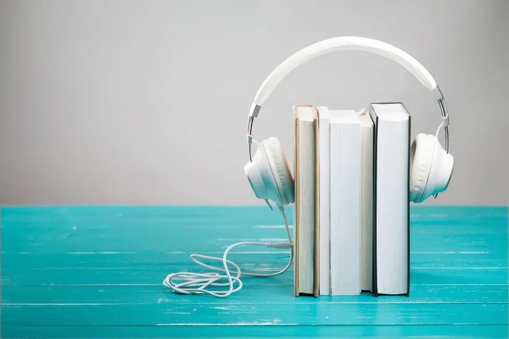 A pair of headphones on three books.