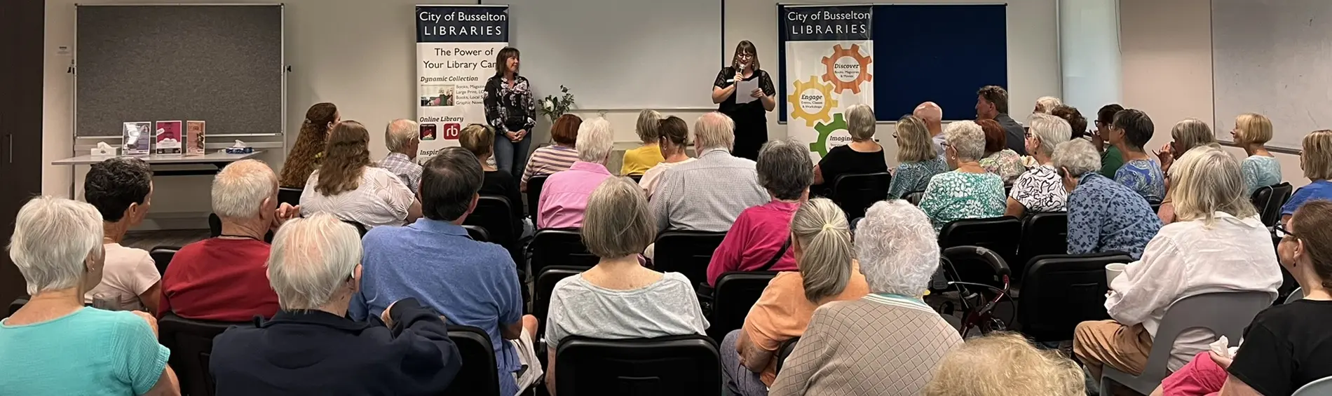 author-talk-fleur-mcdonnald A group of people sitting, viewed from behind, with author Fleur McDonnald standing in front of them.