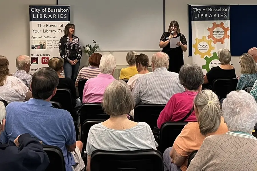 Author Fleur McDonnald standing in front of an audience.